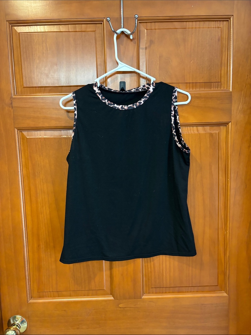 Black tank top with leopard print trim